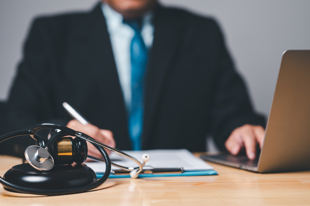 Personal injury lawyer working on laptop in his office