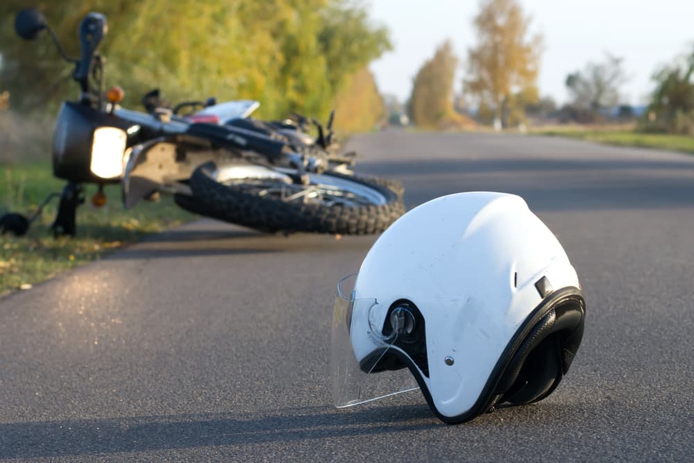 Helmet lying on road after motorcycle accident